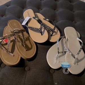 3 pairs of flip flops, silver accents. size 10. All new with tags